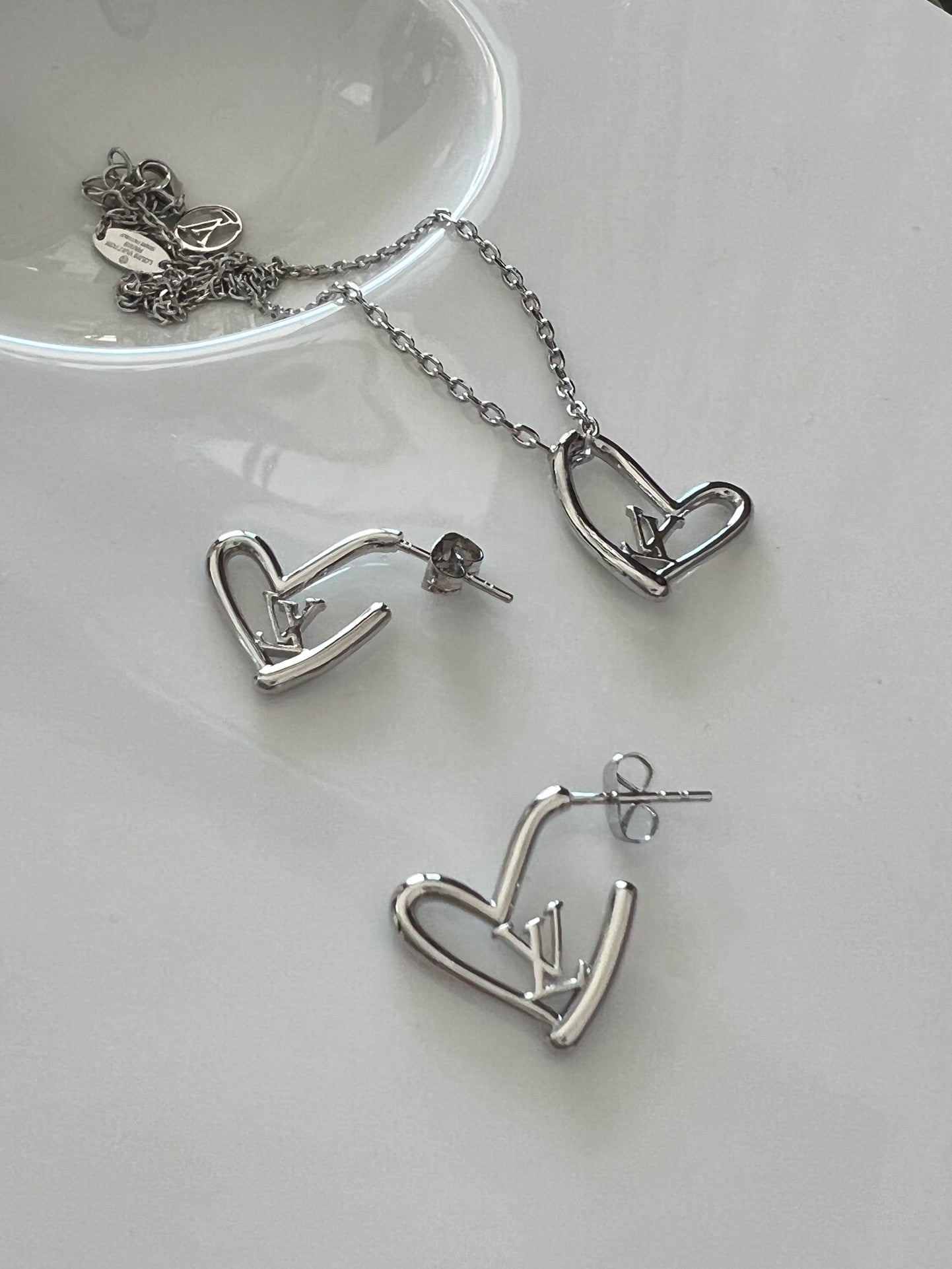 Silver heart-shaped necklace and earrings