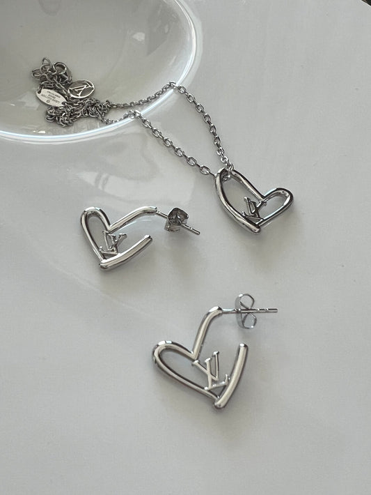 Silver heart-shaped necklace and earrings